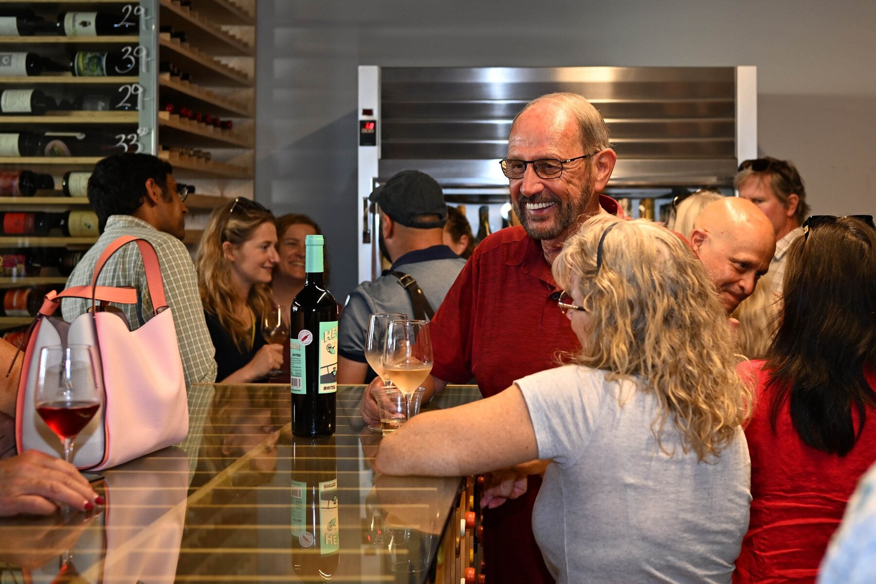 A customer laughing at the bar