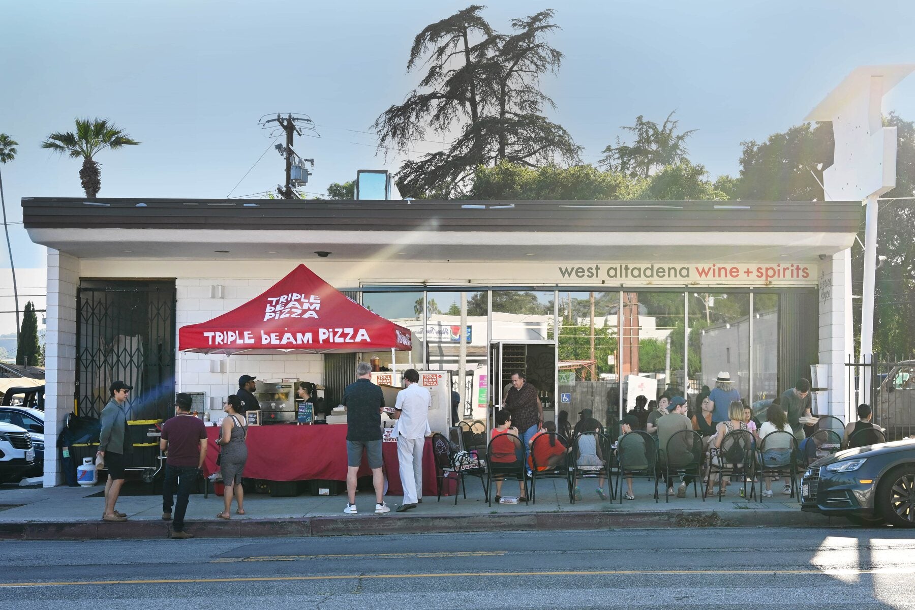 The West Altadena Wine storefront with the Triple Beam Pizza tent out front